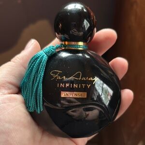 Black Perfume Bottle with Teal Tassel